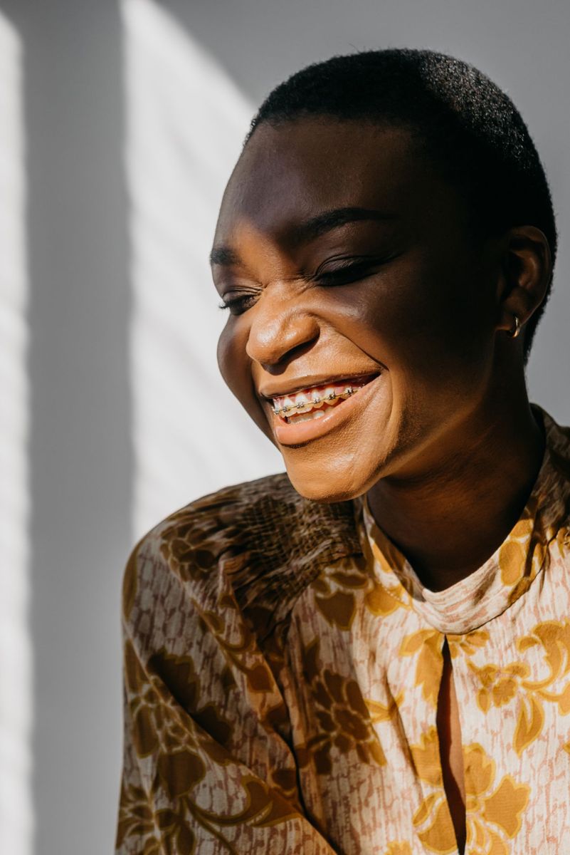 Woman smiling with braces (illustrative stock photo)